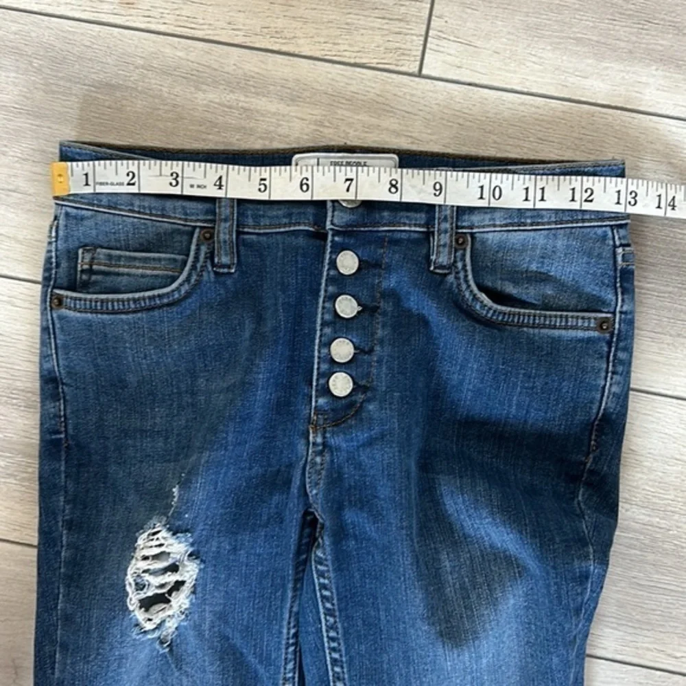 Free People size 25 busted knee button fly jeans